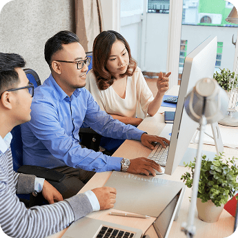 Guerilla 360 team members collaborating in the office